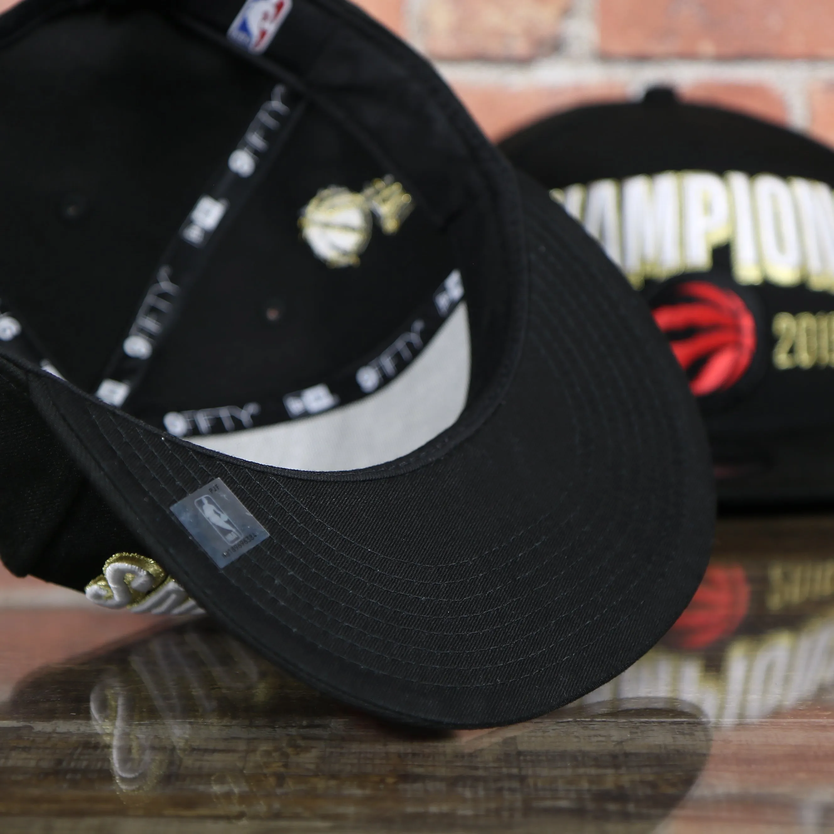 Men's Toronto Raptors New Era Black 2019 NBA Finals On Court Champions Locker Room 9FIFTY Snapback Hat